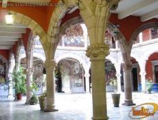 Columns and balconies carved in pink stone