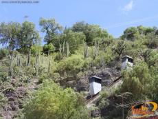 Two cars connected by a cable on a railway lead to the Pipila Monument