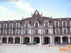 Neoclassical facade covered with tezontle volcanic rock and quarry