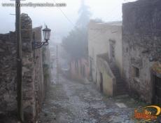 Fog descending upon the town from the canyon