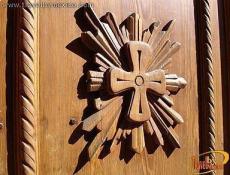 Carved into the entryway door of the Loreto Chapel